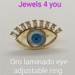 Gold Eye Ring with Blue Accent